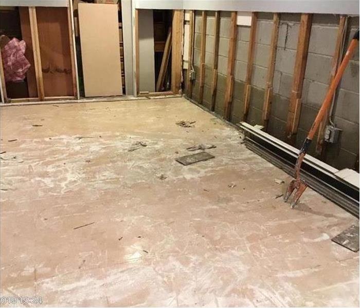 Damaged floor and drywall removed