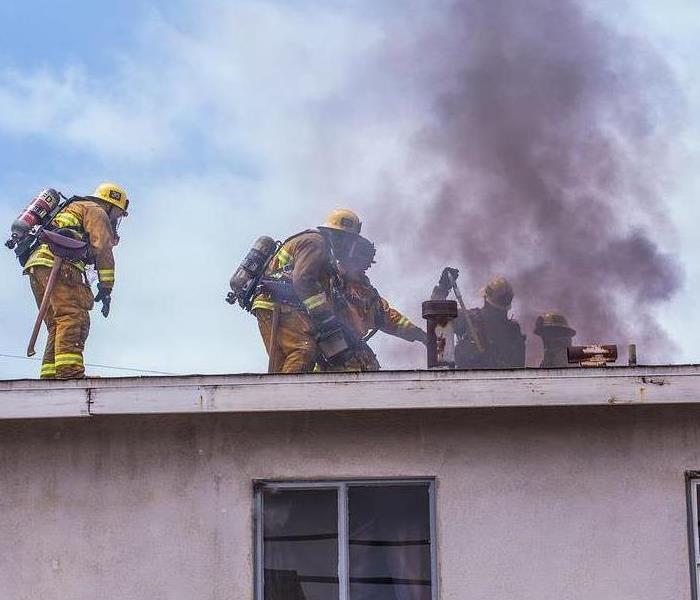 Firefighters at a house fire.